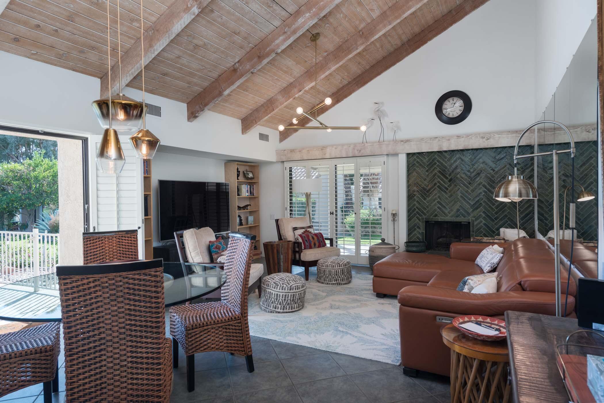 345 Forest Hills Drive Rancho Mirage, CA 92270 - Photo 1 of 37 a living room with furniture and a floor to ceiling window