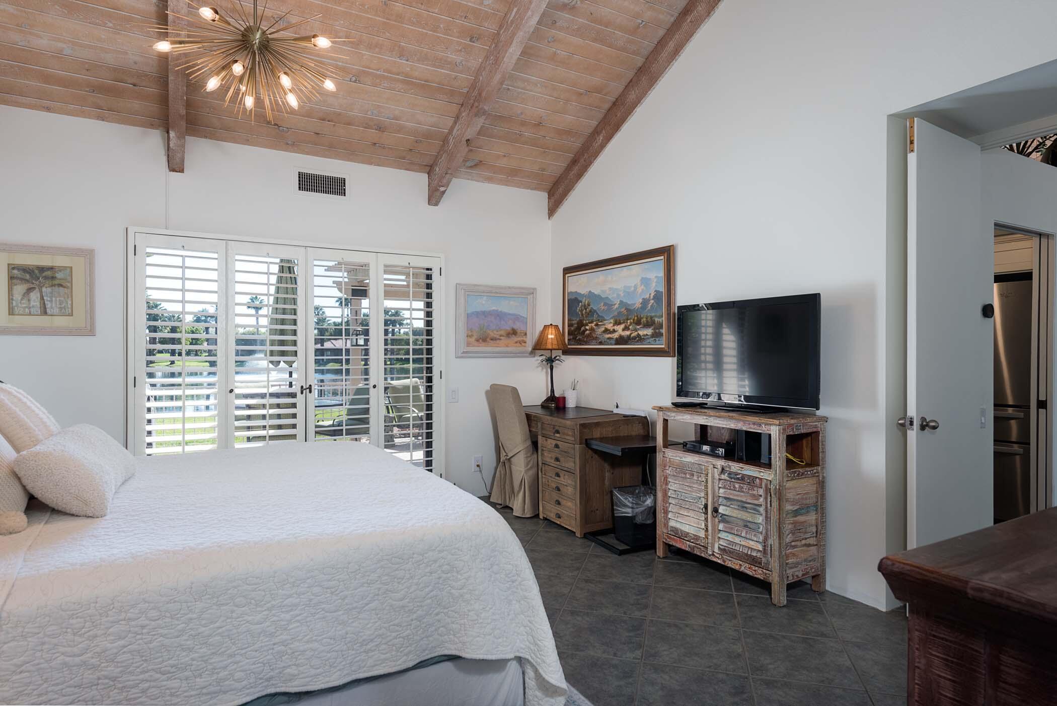 345 Forest Hills Drive Rancho Mirage, CA 92270 - Photo 17 of 37 a view of a livingroom with furniture and a flat screen tv