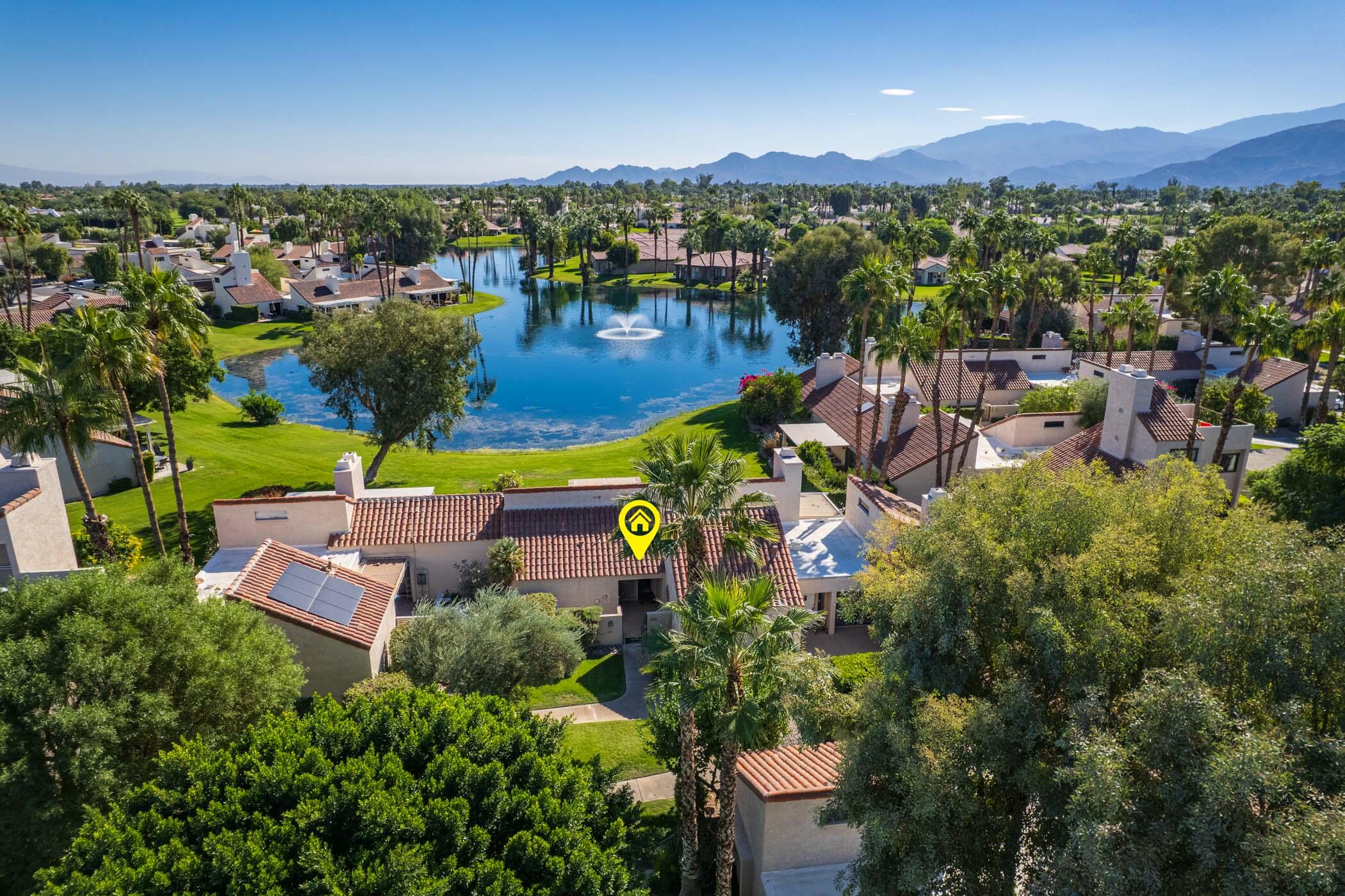 345 Forest Hills Drive Rancho Mirage, CA 92270 - Photo 30 of 37 an aerial view of a houses with a lake view