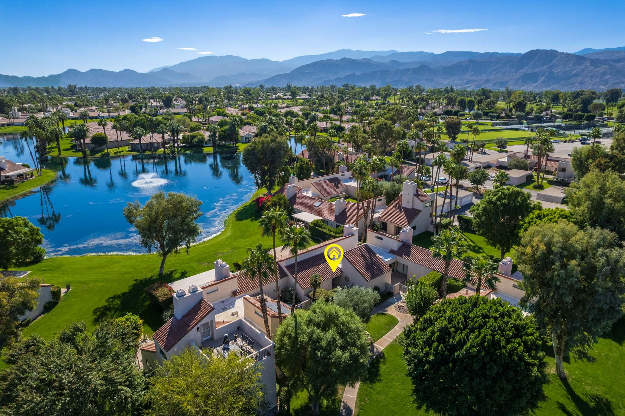 345 Forest Hills Drive Rancho Mirage, CA 92270 - Photo 32 of 37 a view of a city with mountains in the background