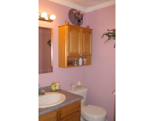 140 Cleveland Street Woonsocket, RI 02895 - Photo 17 of 26 a bathroom with a sink a toilet and mirror