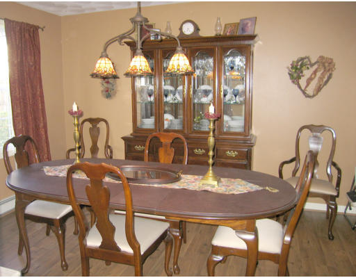 140 Cleveland Street Woonsocket, RI 02895 - Photo 9 of 26 a view of a dining room with furniture and chandelier