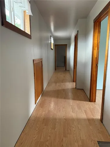 a view of gallery with wooden floor