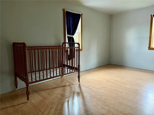 a view of an empty room with stairs