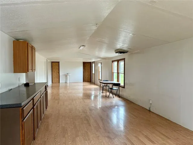 a view of kitchen with furniture and wooden floor