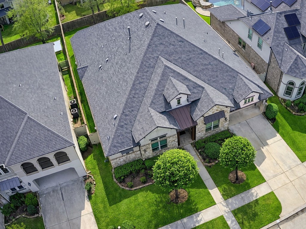 10407 Roseate Skimmer Conroe, TX 77385 - Photo 2 of 30 an aerial view of a house with a garden