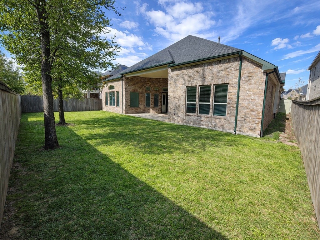 10407 Roseate Skimmer Conroe, TX 77385 - Photo 24 of 30 a view of a house with a yard