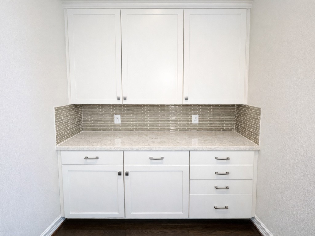 10407 Roseate Skimmer Conroe, TX 77385 - Photo 27 of 30 a view of room with granite countertop cabinets