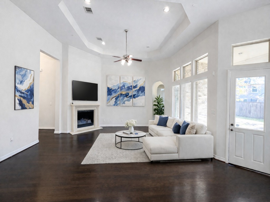 10407 Roseate Skimmer Conroe, TX 77385 - Photo 5 of 30 a living room with furniture fireplace and flat screen tv