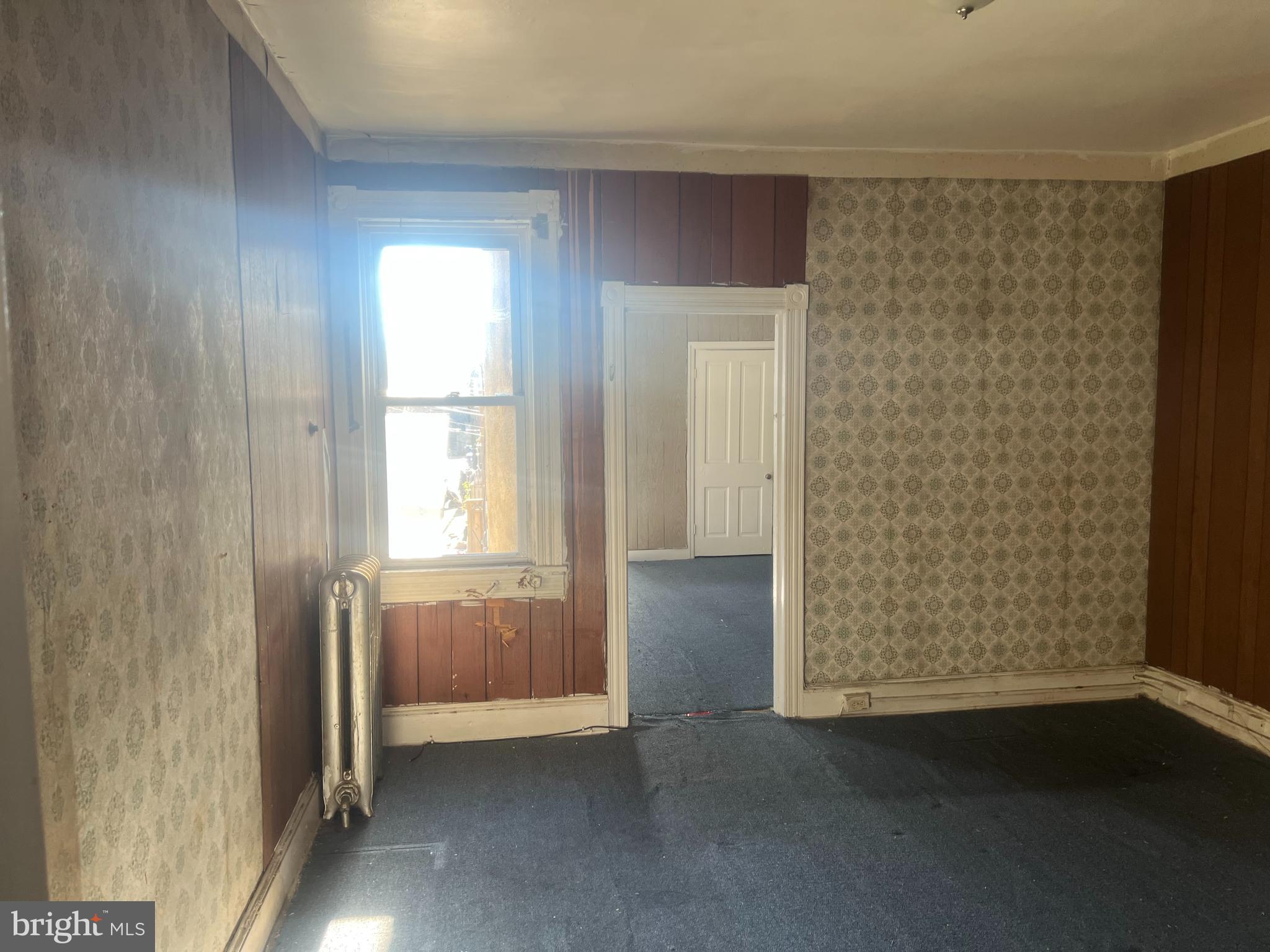 2211 Jefferson Street Baltimore, MD 21205 - Photo 12 of 13 an empty room with windows