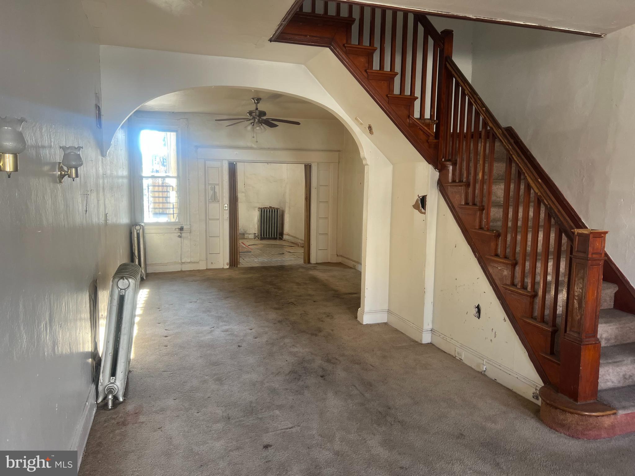 2211 Jefferson Street Baltimore, MD 21205 - Photo 2 of 13 a view of a hallway with entryway and hall with wooden floor