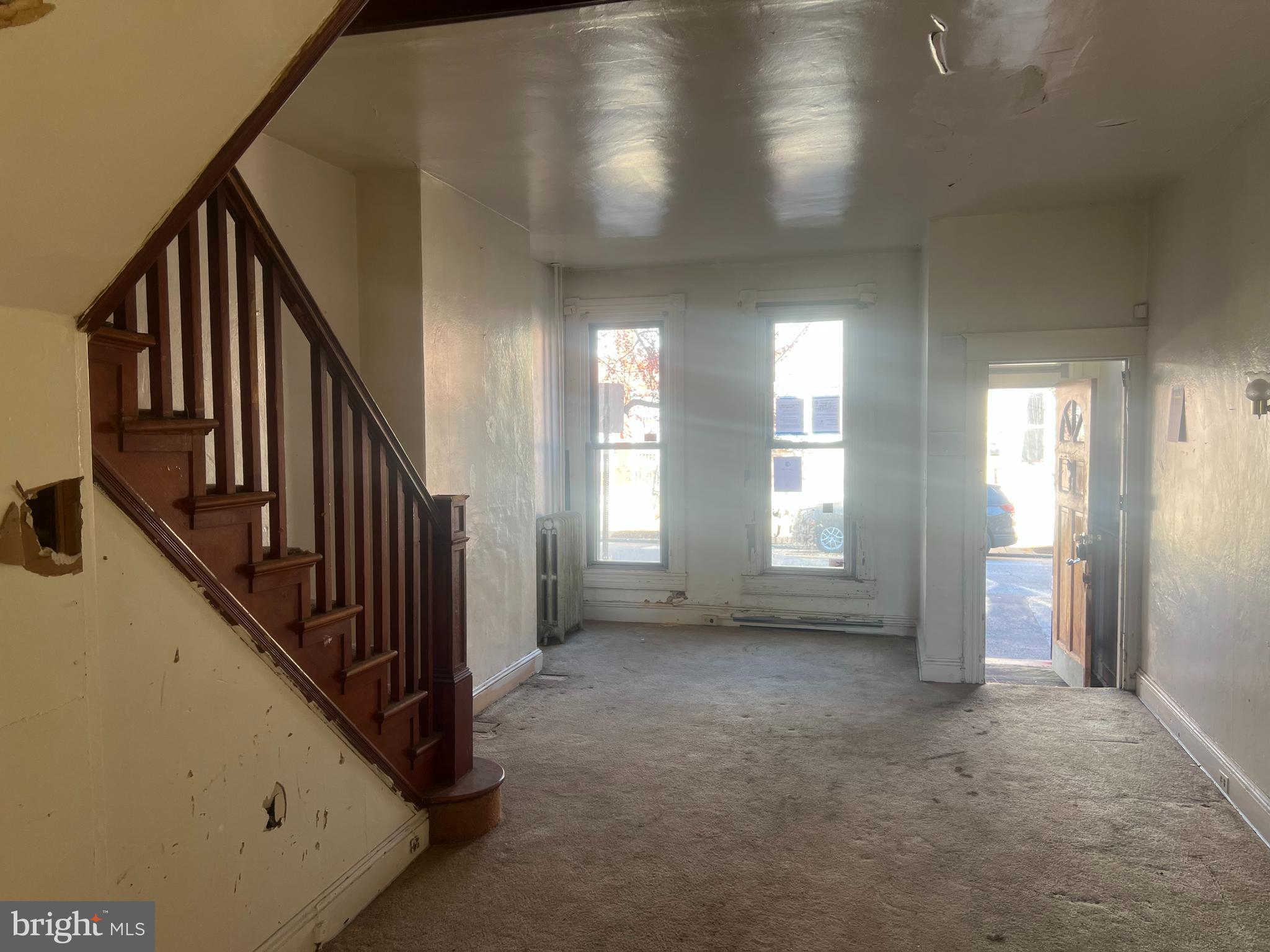 2211 Jefferson Street Baltimore, MD 21205 - Photo 3 of 13 a view of an empty room with wooden floor and windows
