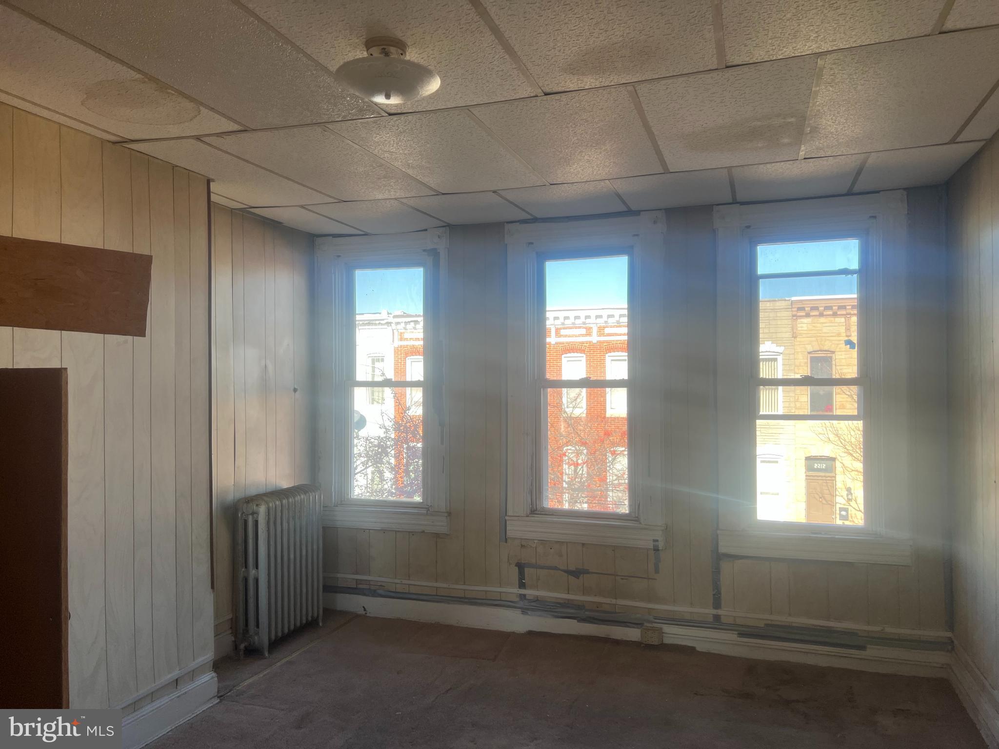 2211 Jefferson Street Baltimore, MD 21205 - Photo 10 of 13 an empty room with windows