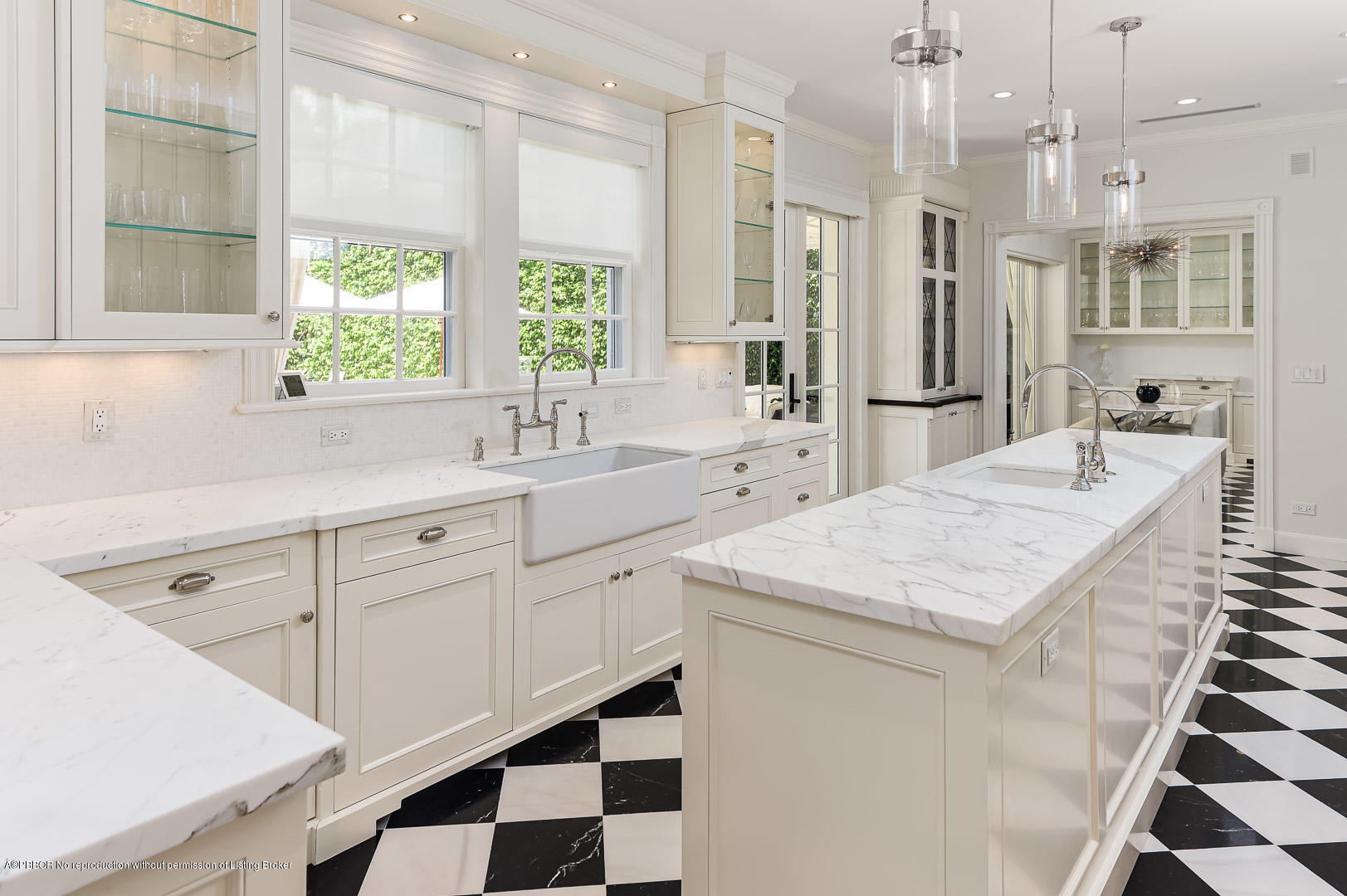 130 Cocoanut Row Palm Beach, FL 33480 - Photo 12 of 31 a kitchen with stainless steel appliances kitchen island granite countertop a sink and a refrigerator