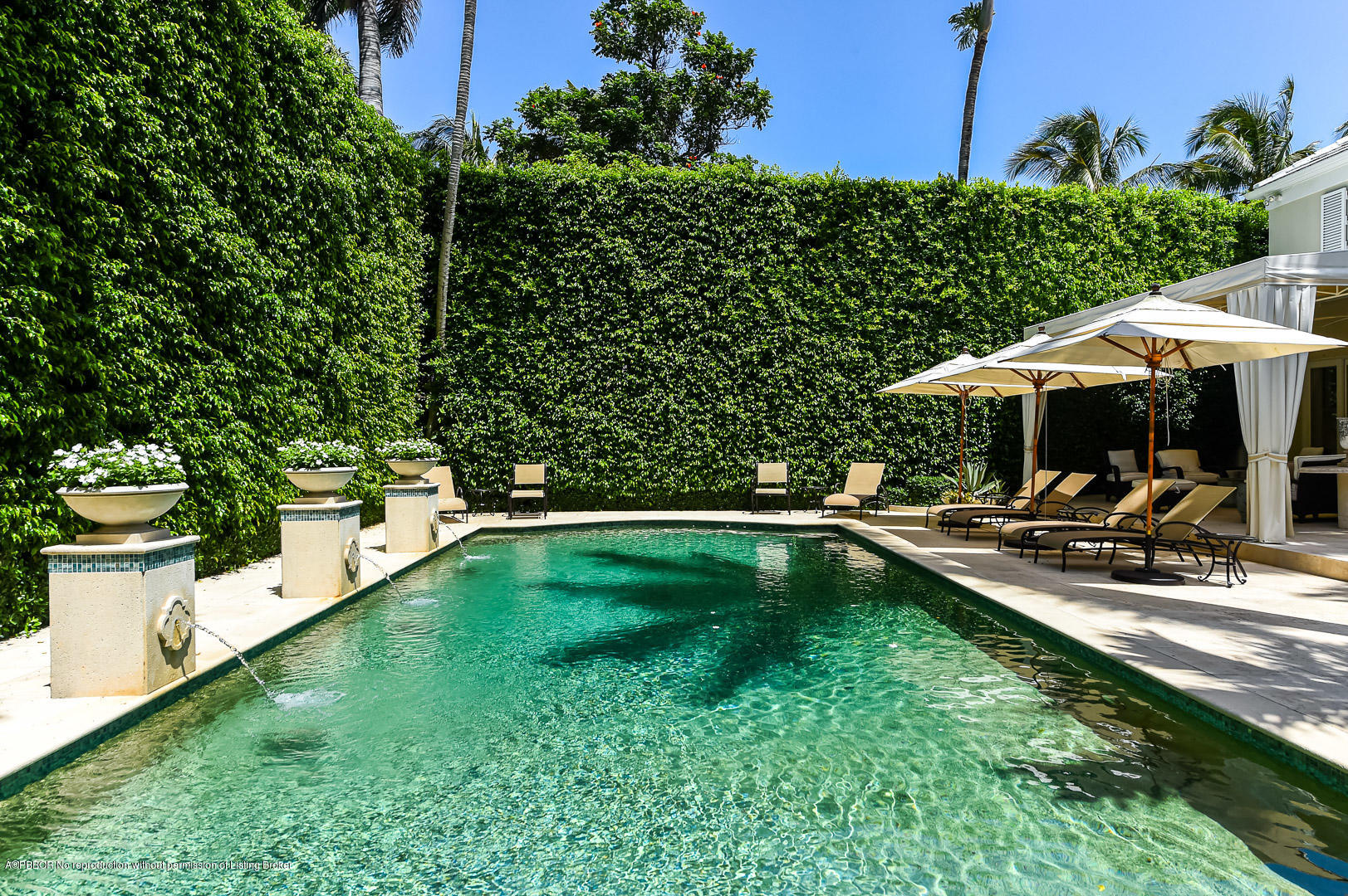 130 Cocoanut Row Palm Beach, FL 33480 - Photo 3 of 31 a view of swimming pool with chairs and garden