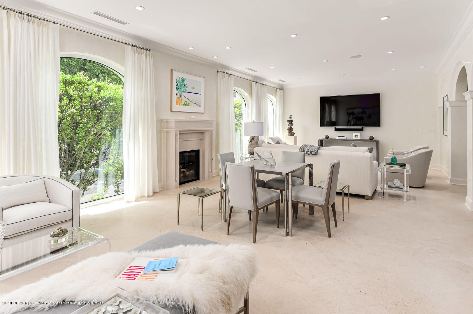 130 Cocoanut Row Palm Beach, FL 33480 - Photo 10 of 31 a living room with furniture a flat screen tv and a large window