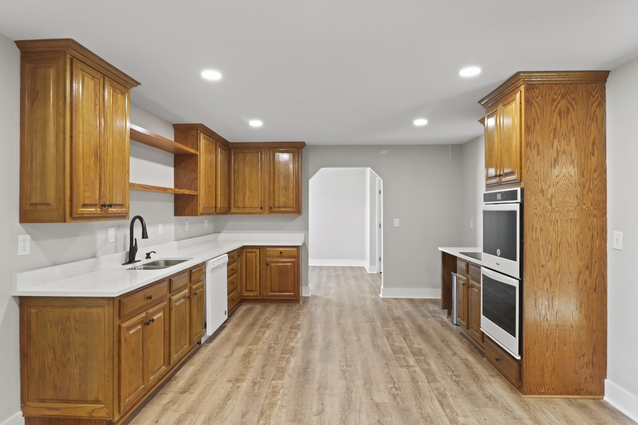 4845 Pulliam-Hardaway Road Springfield, TN 37172 - Photo 9 of 26 a large kitchen with stainless steel appliances granite countertop a sink a stove a refrigerator cabinets and wooden floor