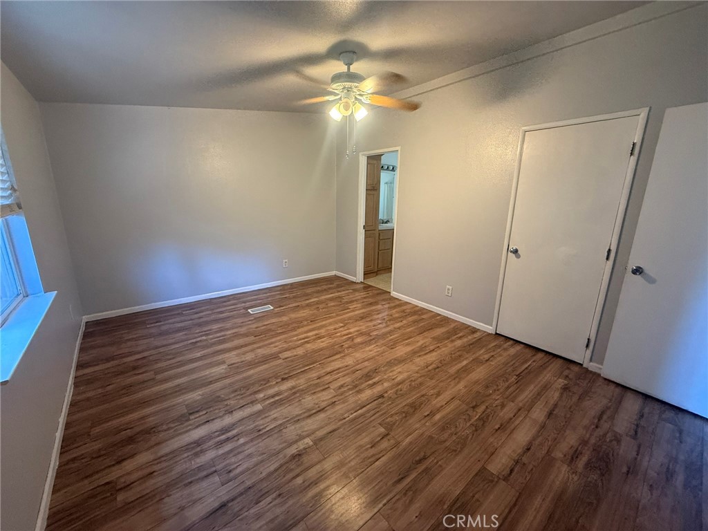6845 Floyd Way Nice, CA 95464 - Photo 30 of 59 a view of empty room with wooden floor