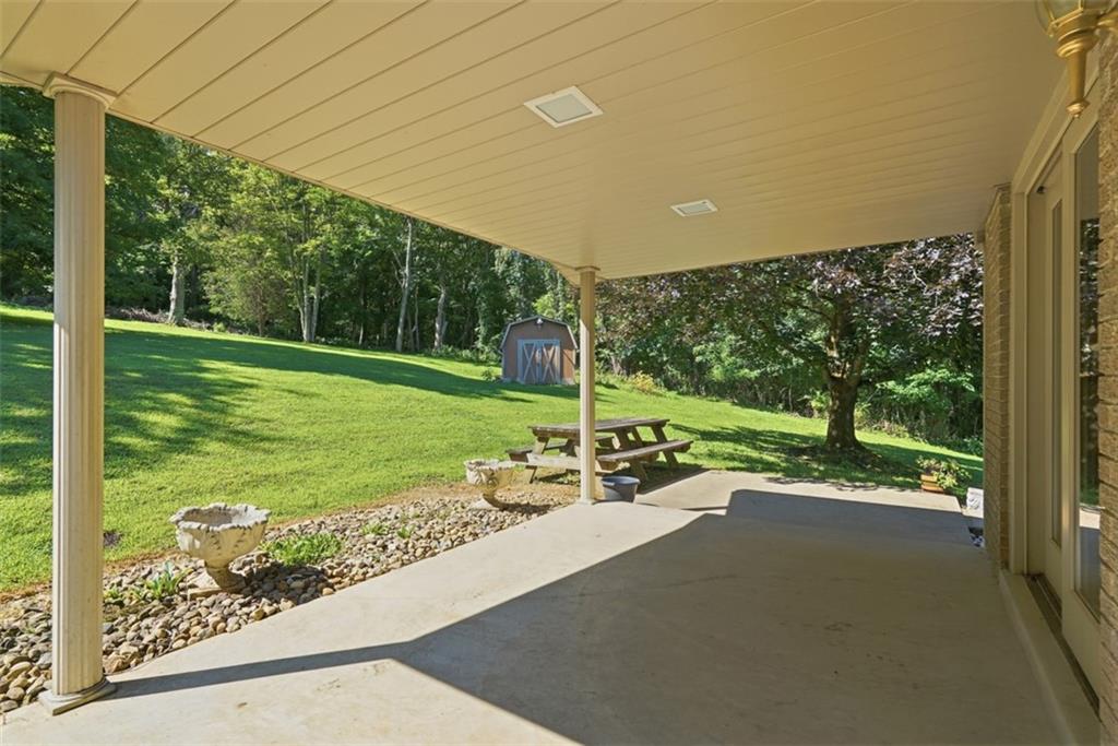 62 Chippewa Road Bentleyville, PA 15314 - Photo 24 of 34 The large covered patio opens to the beautiful back yard.