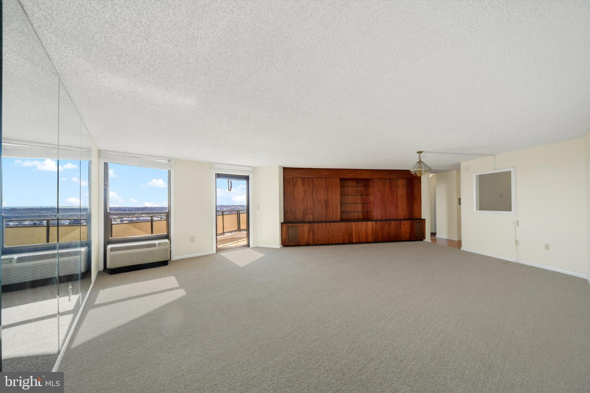 205 East Joppa Road, Unit 1604 Towson, MD 21286 - Photo 10 of 24 an empty room with furniture and a window