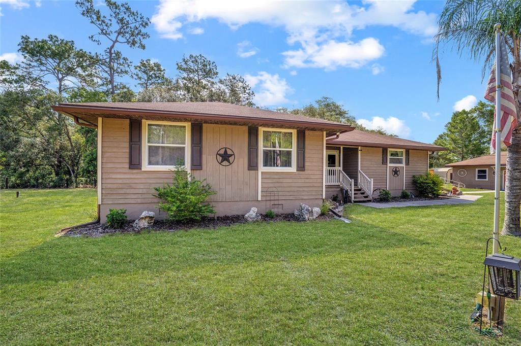 15755 Southwest 90th Avenue Dunnellon, FL 34432 - Photo 4 of 55 a view of a house with a backyard
