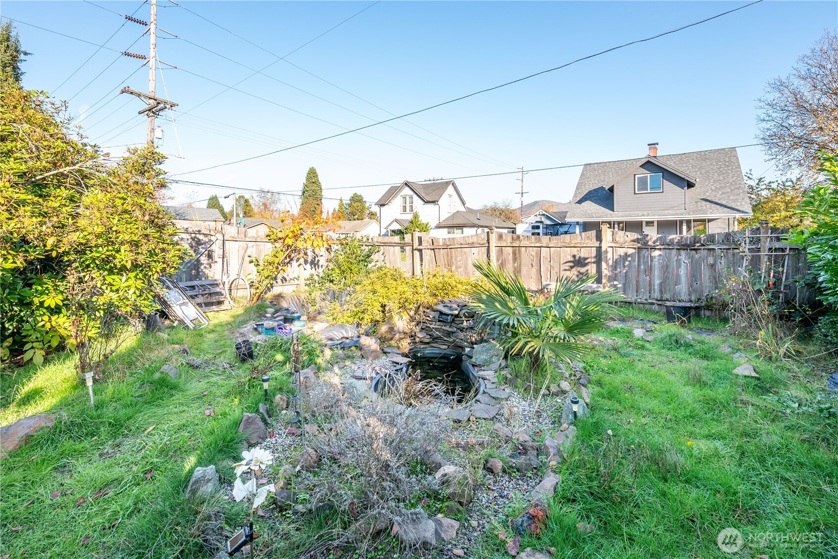 411 4th Avenue Southwest Castle Rock, WA 98611 - Photo 13 of 29 a view of a lake with a house in the background