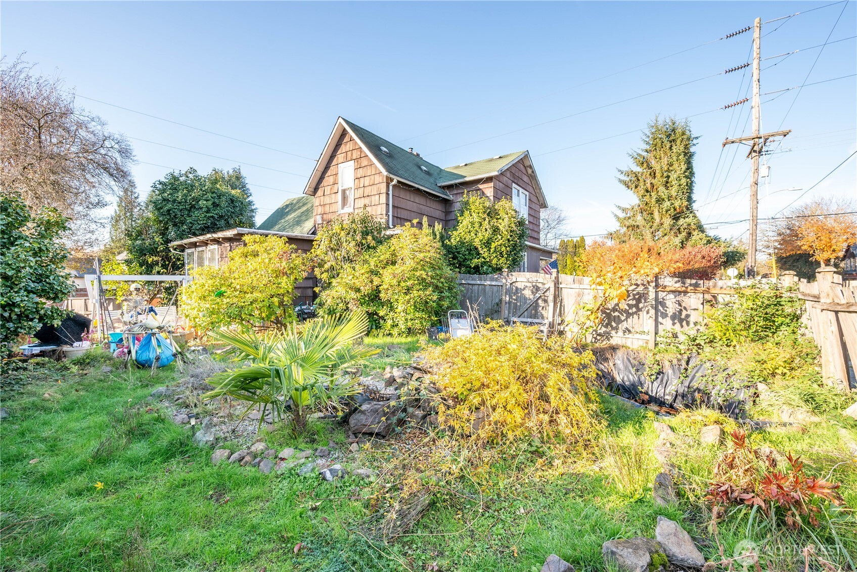 411 4th Avenue Southwest Castle Rock, WA 98611 - Photo 14 of 29 a front view of a house with a yard and fountain