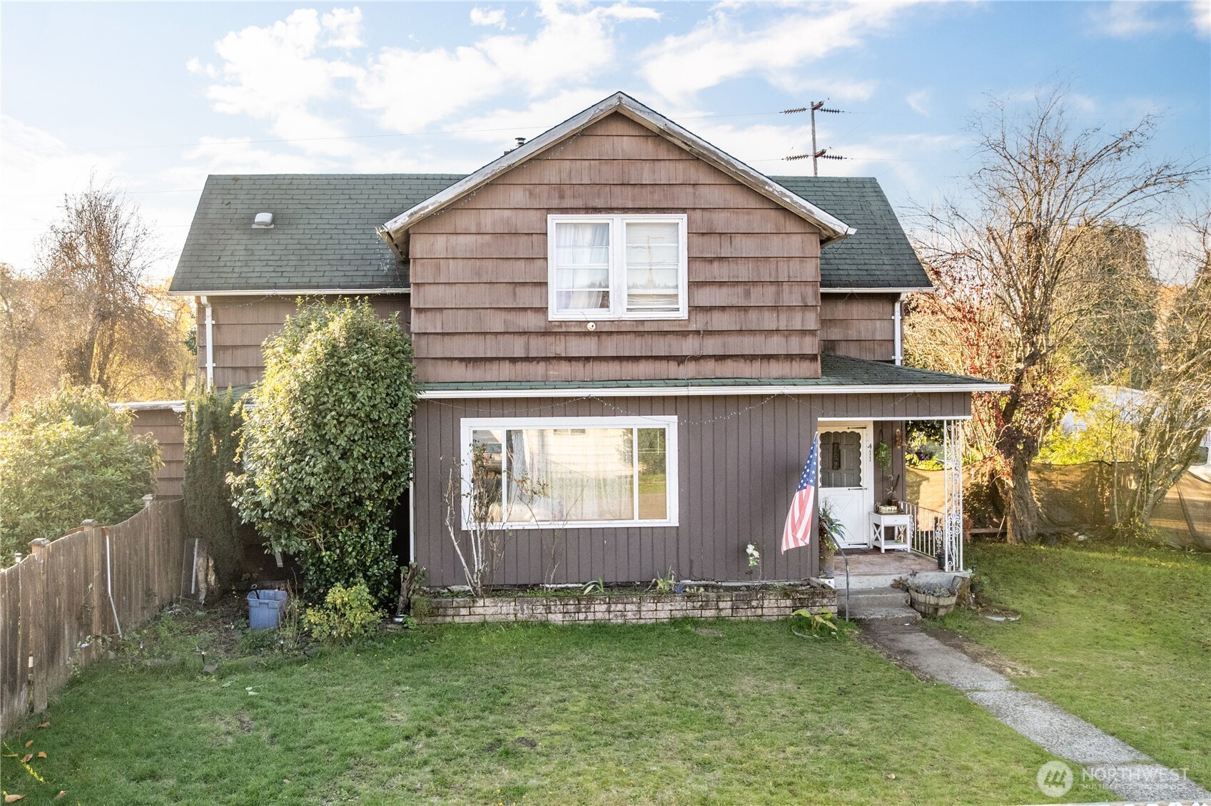 411 4th Avenue Southwest Castle Rock, WA 98611 - Photo 15 of 29 a front view of a house with a yard and garage