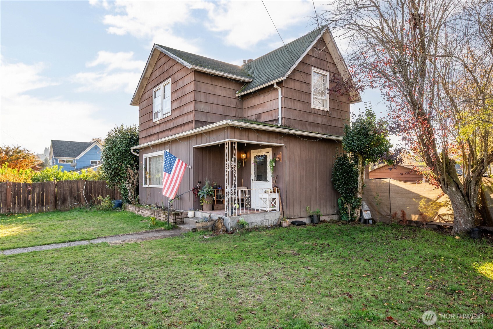 411 4th Avenue Southwest Castle Rock, WA 98611 - Photo 4 of 29 a view of a house with a yard and sitting area