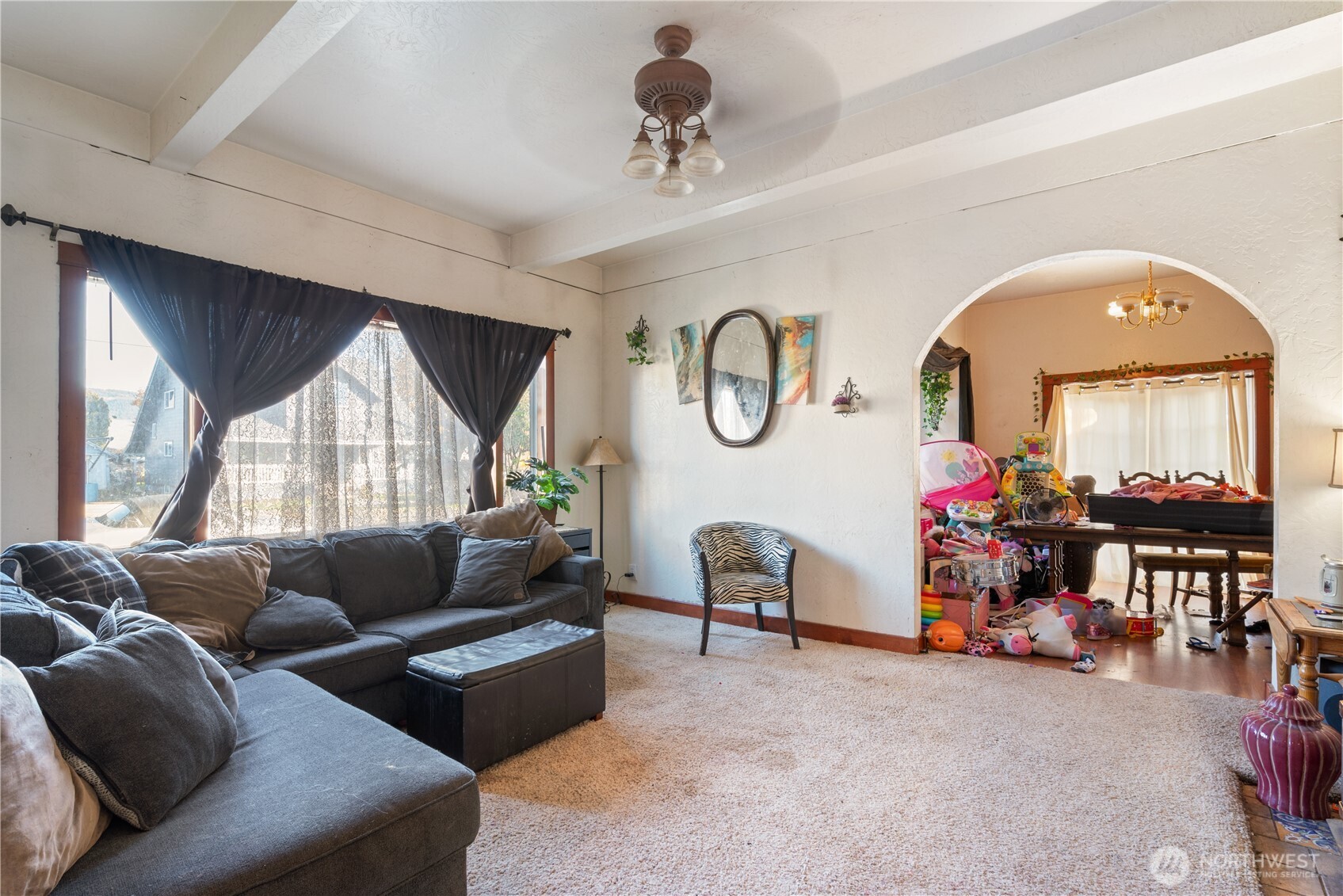 411 4th Avenue Southwest Castle Rock, WA 98611 - Photo 7 of 29 a living room with furniture a window and a clock