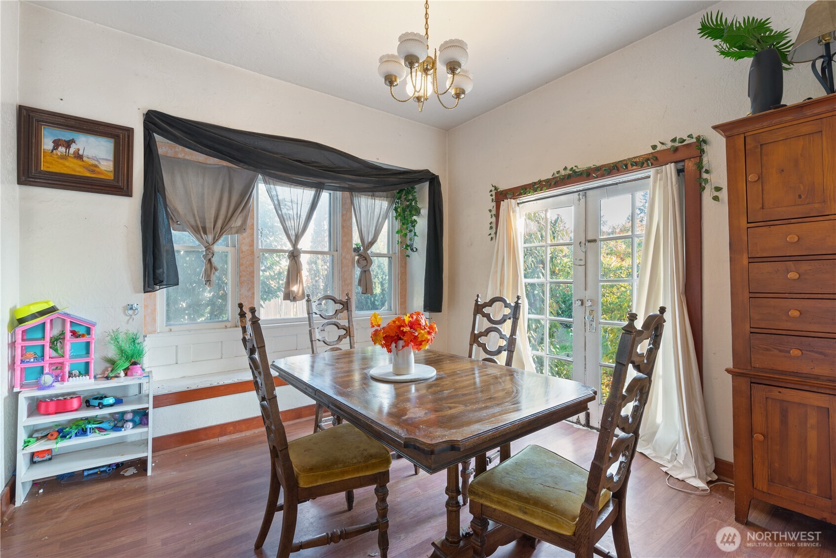 411 4th Avenue Southwest Castle Rock, WA 98611 - Photo 8 of 29 a view of a dining room with furniture window and wooden floor