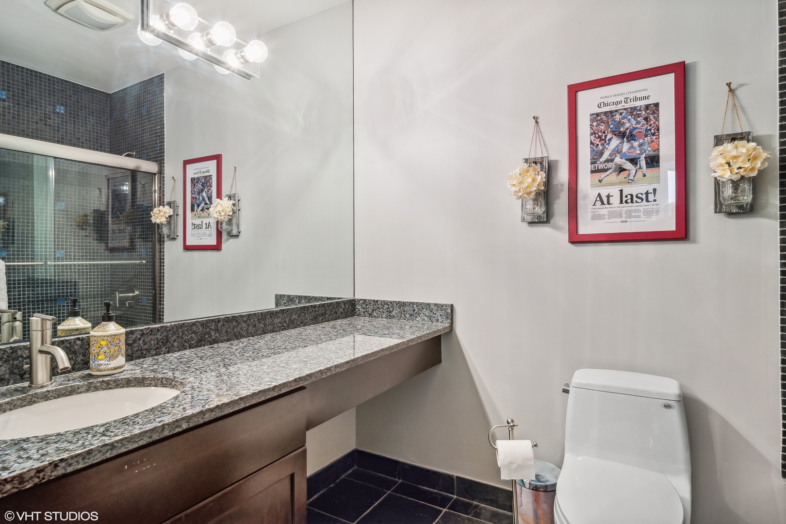119 West Chestnut Street, Unit 4W Chicago, IL 60610 - Photo 14 of 18 a bathroom with a granite countertop sink a toilet and a mirror