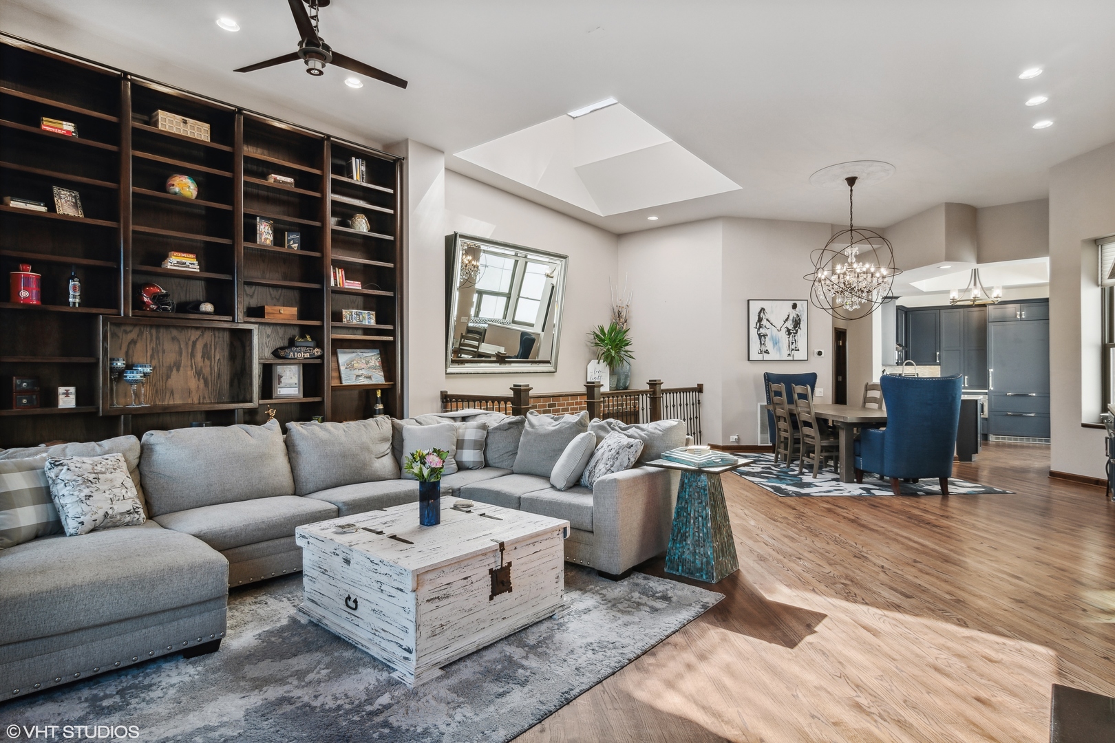 119 West Chestnut Street, Unit 4W Chicago, IL 60610 - Photo 2 of 18 a living room with furniture a chandelier and a dining table