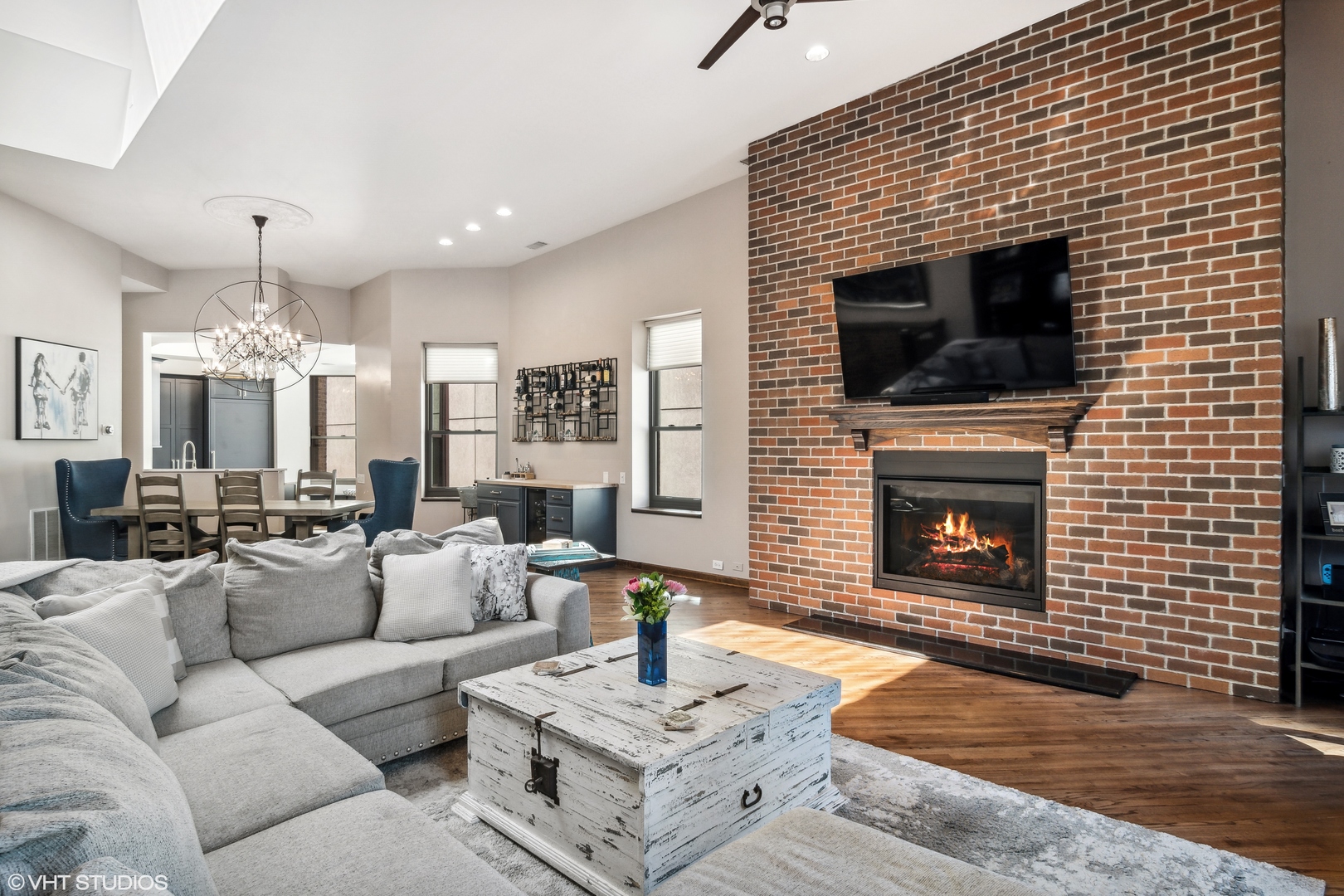 119 West Chestnut Street, Unit 4W Chicago, IL 60610 - Photo 4 of 18 a living room with furniture a fireplace and a flat screen tv