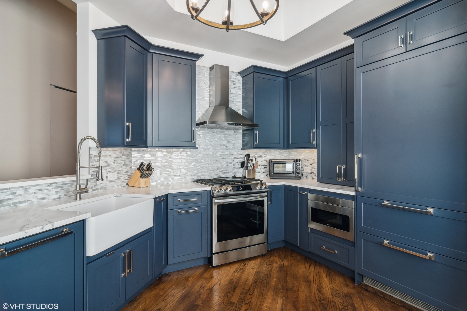 119 West Chestnut Street, Unit 4W Chicago, IL 60610 - Photo 8 of 18 a kitchen with stainless steel appliances granite countertop a stove sink and cabinets