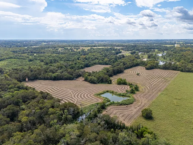 a view of a lake with a yard