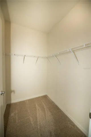 a large bathroom with a granite countertop sink and a mirror