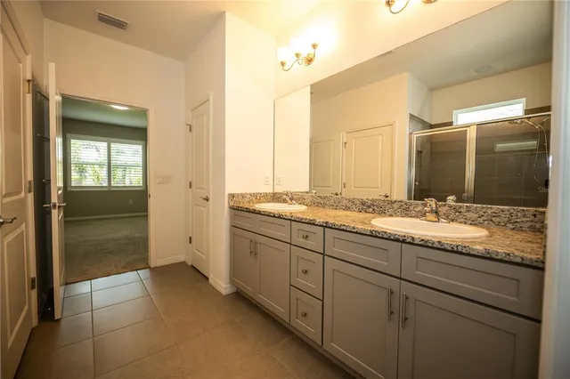 a view of a kitchen with a sink and dishwasher cabinets