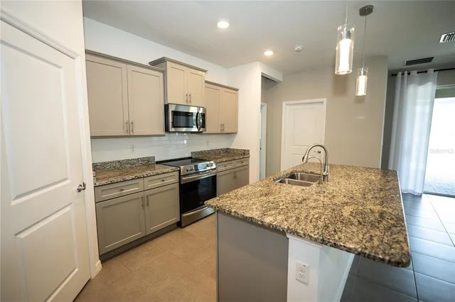 a view of swimming pool with seating space