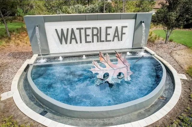 a view of a room with gym equipment and large windows