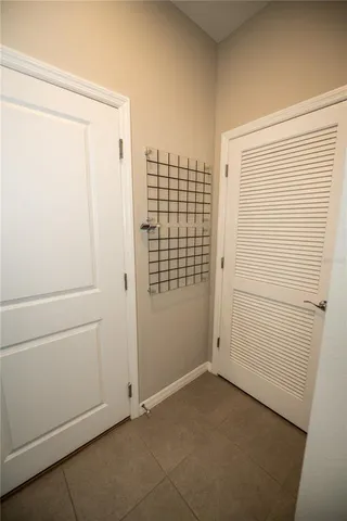 a view of an empty room and a window