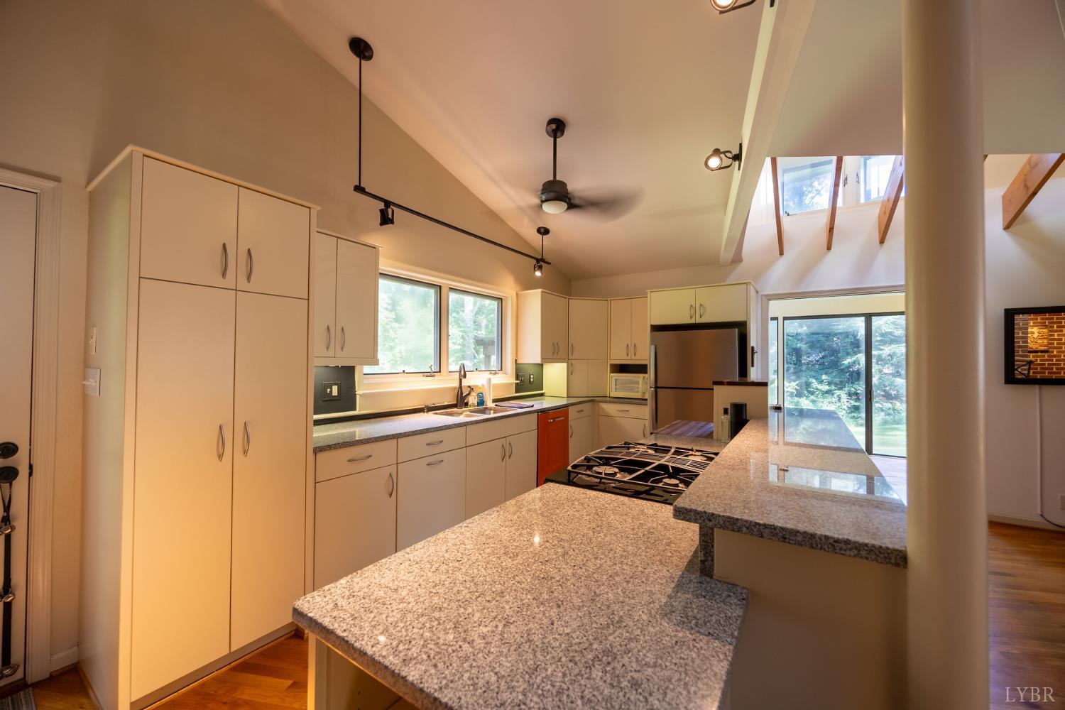2246 Country Club Road Appomattox, VA 24522 - Photo 11 of 41 a kitchen with stainless steel appliances granite countertop a sink stove and refrigerator