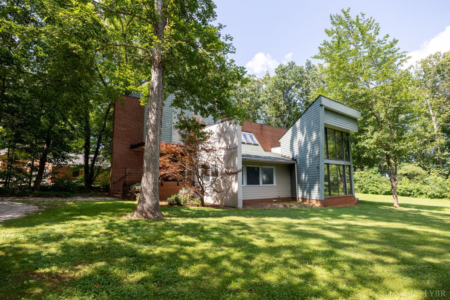 2246 Country Club Road Appomattox, VA 24522 - Photo 2 of 41 a front view of a house with garden