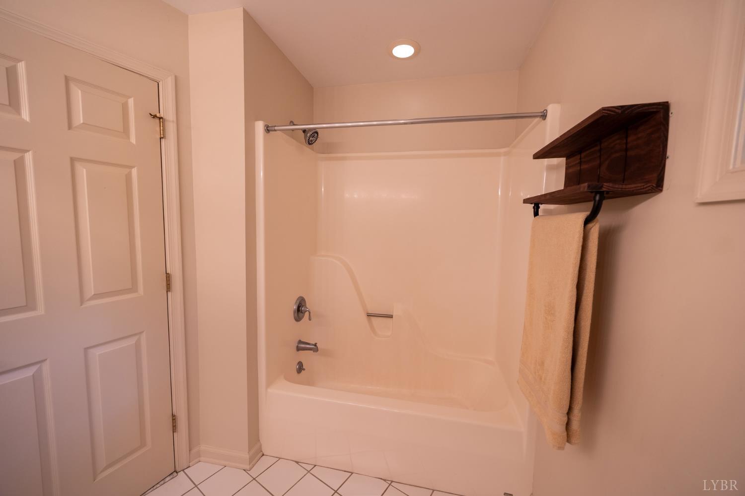 2246 Country Club Road Appomattox, VA 24522 - Photo 32 of 41 a bathroom with a shower and a bath tub