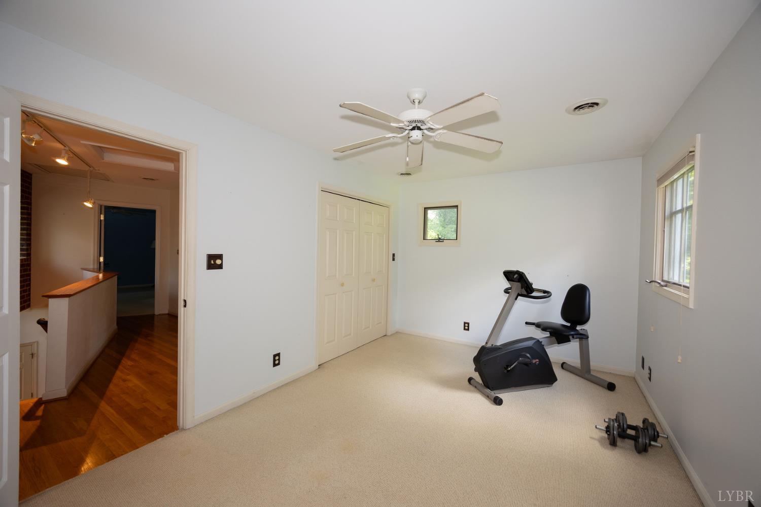 2246 Country Club Road Appomattox, VA 24522 - Photo 38 of 41 a view of a room with gym equipment and windows