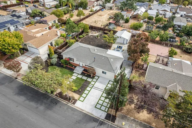 an aerial view of residential house with outdoor space