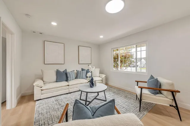 a living room with furniture and a table