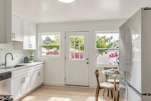 a bedroom with a large bed and a chair