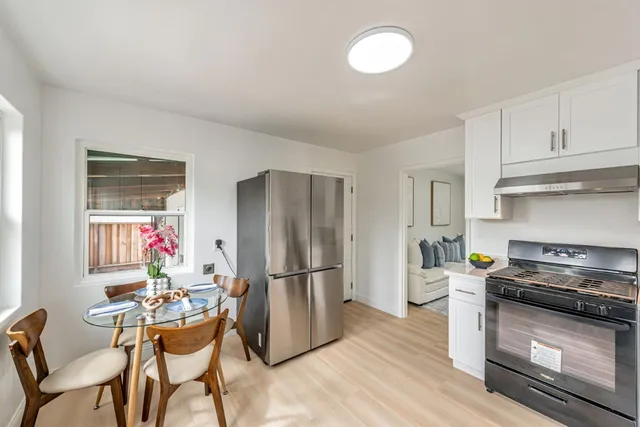 a bedroom with a bed and a lamp on table