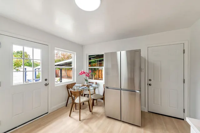 a bedroom with a bed and a chair